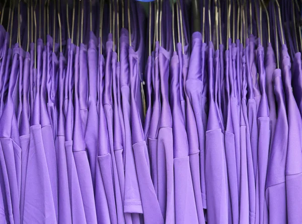 many purple shirts of football players