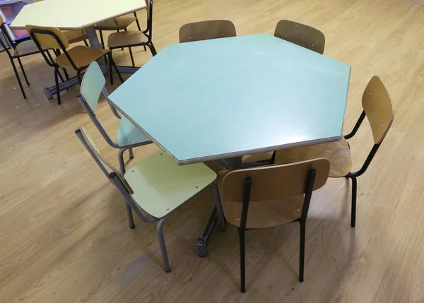 Hexagonal table with the chairs of a school class for children — Stock Photo, Image