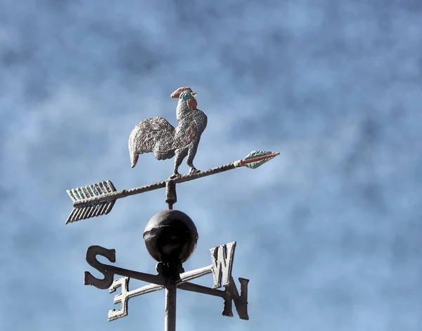 vane to mark the wind with the arrows of the cardinal points