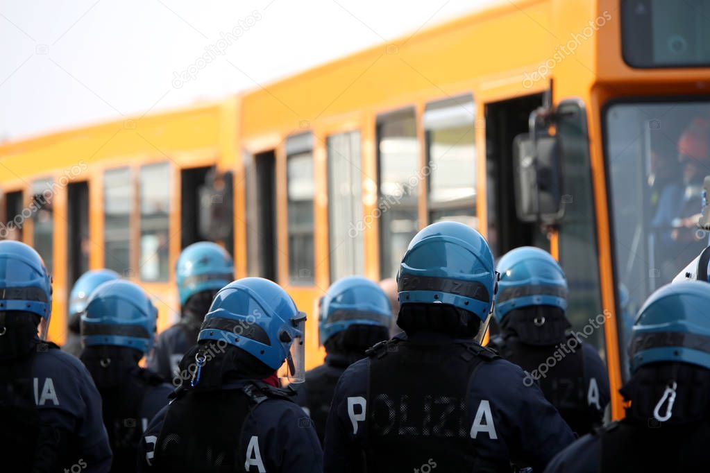 riot police while escorting the bus to the stadium