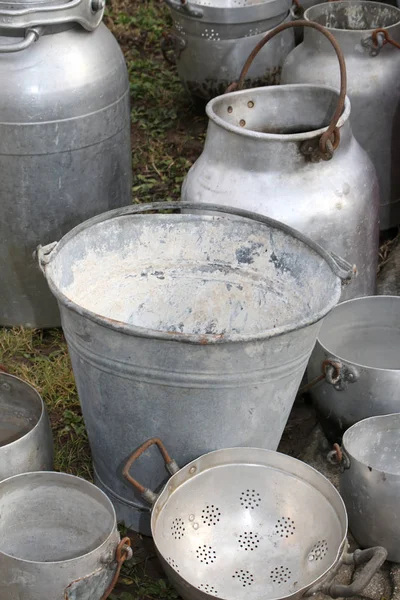 Old buckets and other containers in aluminum — Stock Photo, Image