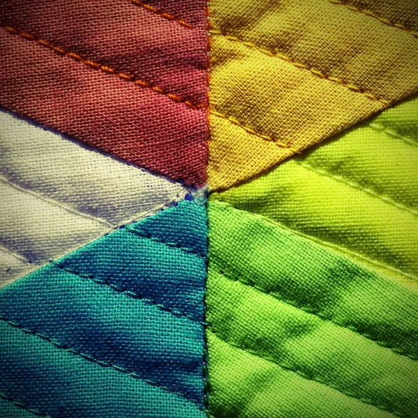 Bordado de tela colorida fotografiado con una lente macro un — Foto de Stock