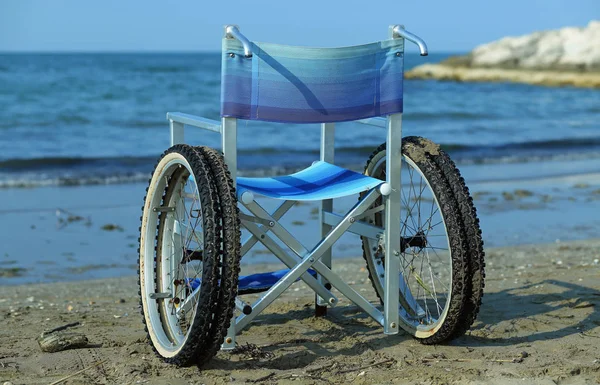 Modern wheelchair by the sea in summer with large wheels — Stock Photo, Image
