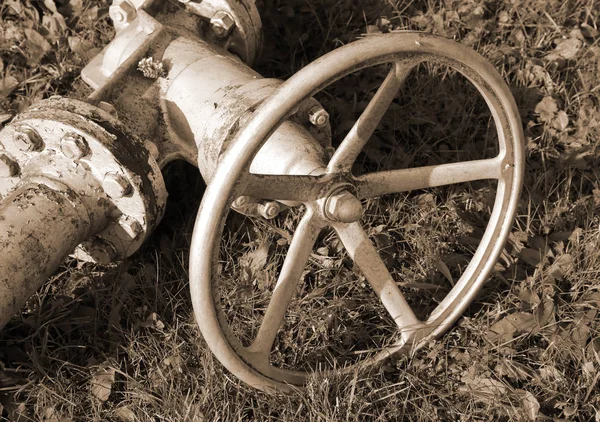 Big old shut-off valve with sepia effect — Stock Photo, Image