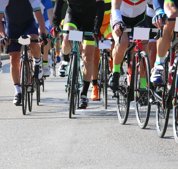 Fast cyclists during the race on city roads — Stock Photo, Image