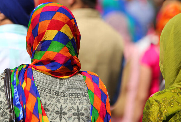 sikh women with multicolored veil during a religion ceremony