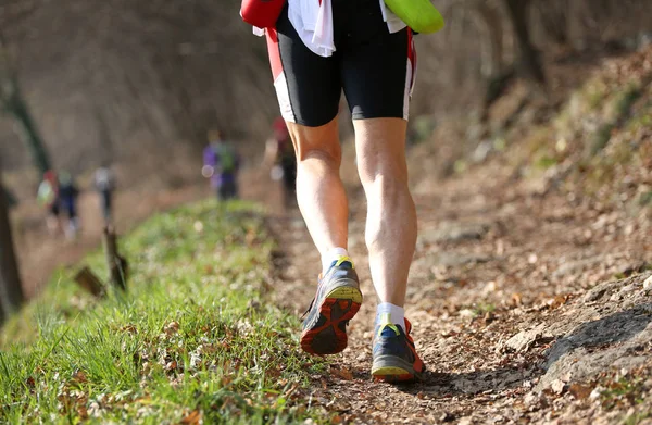 Athlete runner from behind with sporty clothes during the racing — Stock Photo, Image