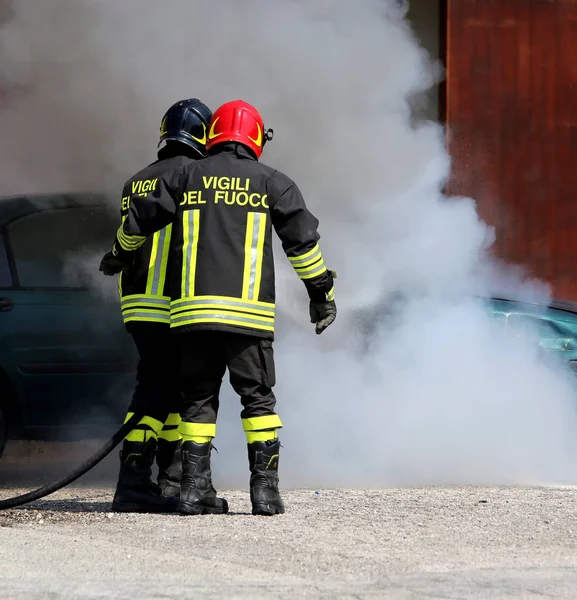 Italian fire brigade with the letter on the uniform meaning fire Stock Picture