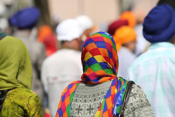 Women with the veil over their heads during a religious event on