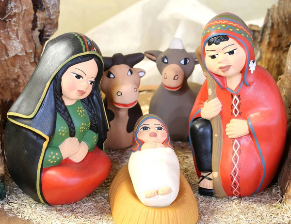 Peruvian holy family with South America dressed with two animals — Stock Photo, Image