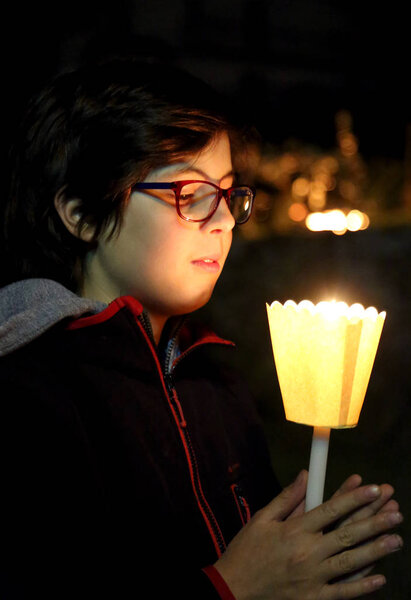 Young boy with candle