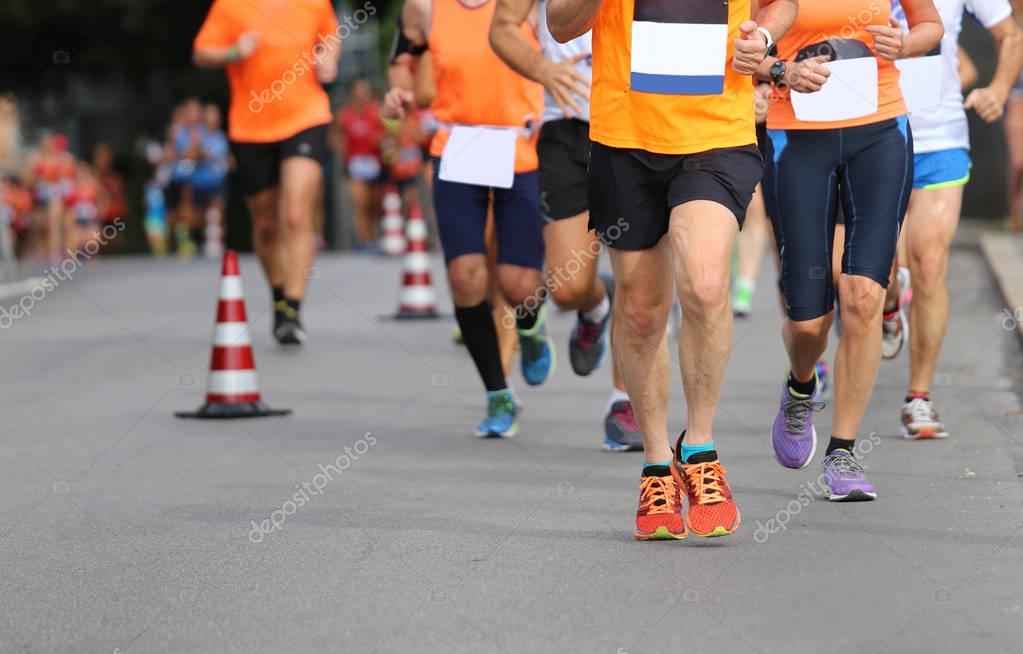 Many athletes run the marathon on the city road without logos and brand