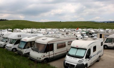 Asiago, VI, Italy - May 27, 2017: Many campers vehicles in the p clipart