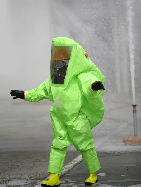 Green protective suit with air filtering system to breathe durin — Stock Photo, Image