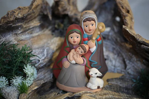 peruvian family with white sheep with winter clothes in Latin Am