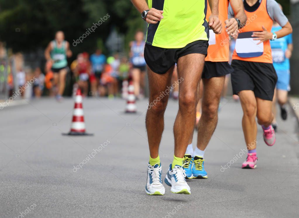 Many athletes run the marathon on the city road without logos and brand