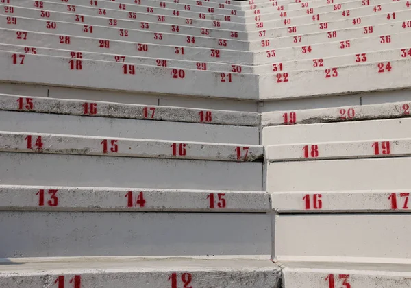 Numbers on the stadium bleachers to indicate a seat at events — Stock Photo, Image