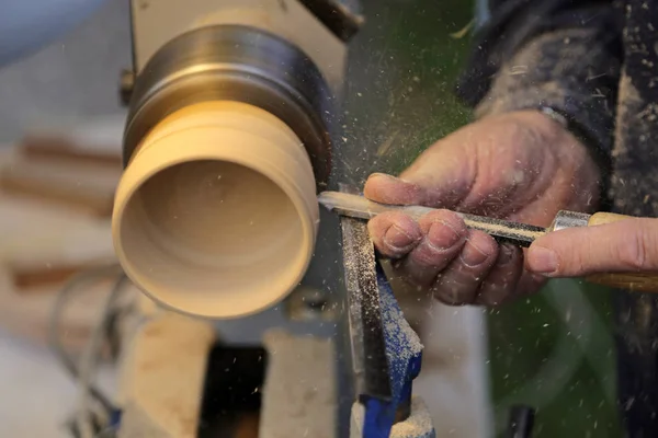 Skilled artisan during the work of the wooden piece in the carpe — Stock Photo, Image