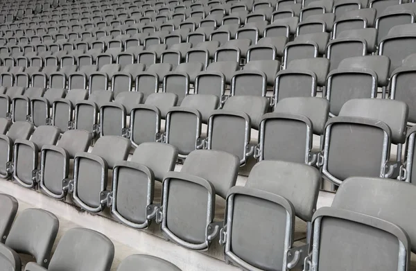 Reclining chairs on the stadium bleachers with nobody — Stock Photo, Image