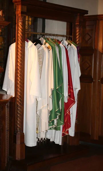 Dresses for dressing priests in the sacristy of an ancient Chris — Stock Photo, Image