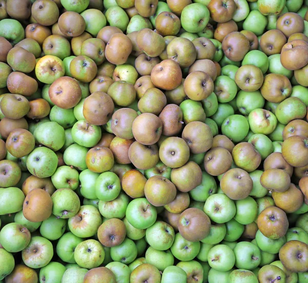 Bakgrund av många gröna äpplen — Stockfoto