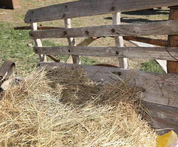 Straw and hay over the wagon of the farm — Stock Photo, Image