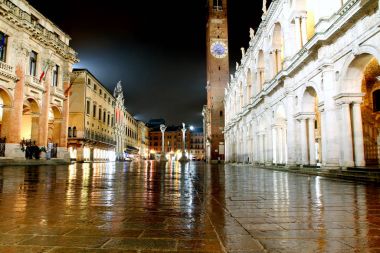 Main city square and palladian basilica with tower at night in V clipart