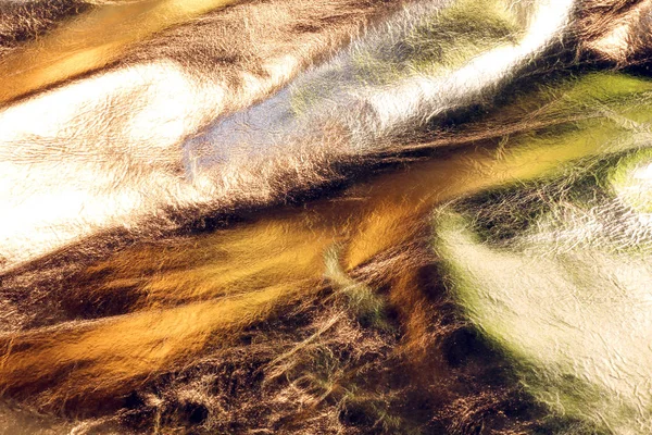 Золотистый кожаный фон с очень ярким цветом — стоковое фото