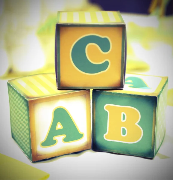 Letter of the alphabet written on cubes of an old elementary sch — Stock Photo, Image