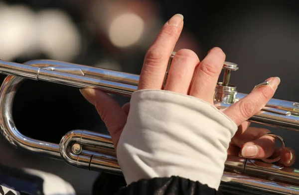 Small hand of young girl playing the trumpet in the music band — Stock Photo, Image