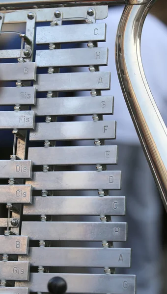 Xylophone with letters on metal bars that indicate musical notes — Stock Photo, Image