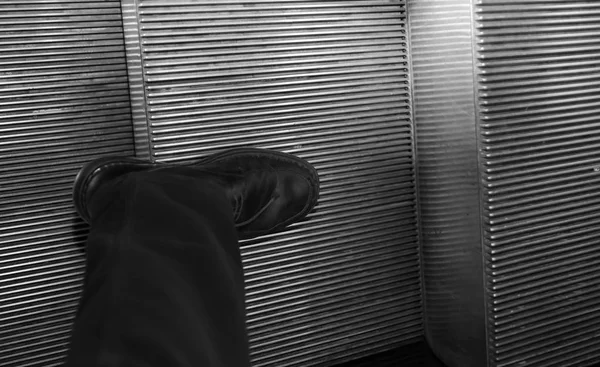 Black shoe for man on the escalators — Stock Photo, Image