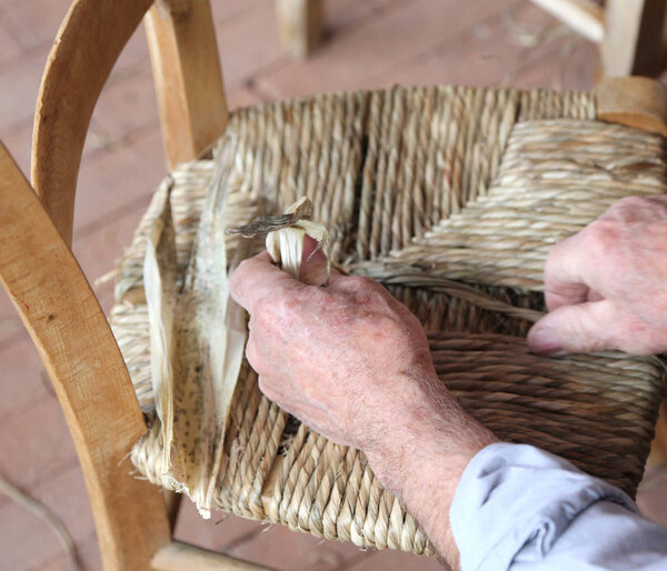 hand of an expert stuffing chair