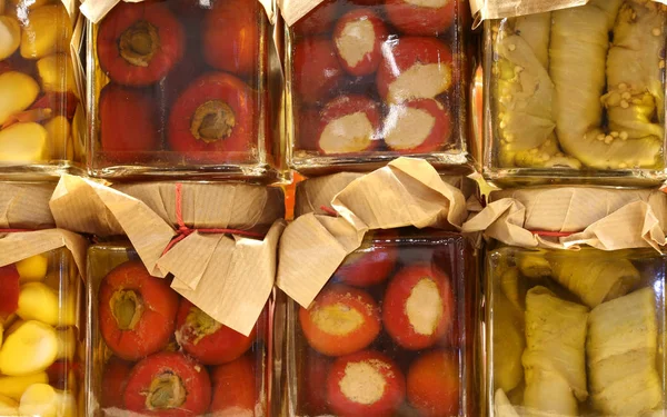 Jars of Italian products preserved in oil with green peppers gar — Stock Photo, Image