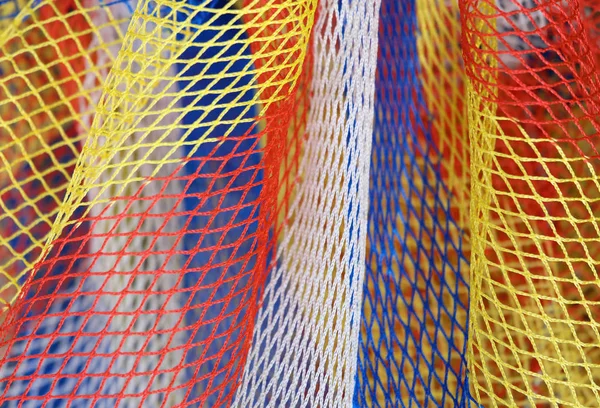 Achtergrond van een net van een speelgoed visnet — Stockfoto