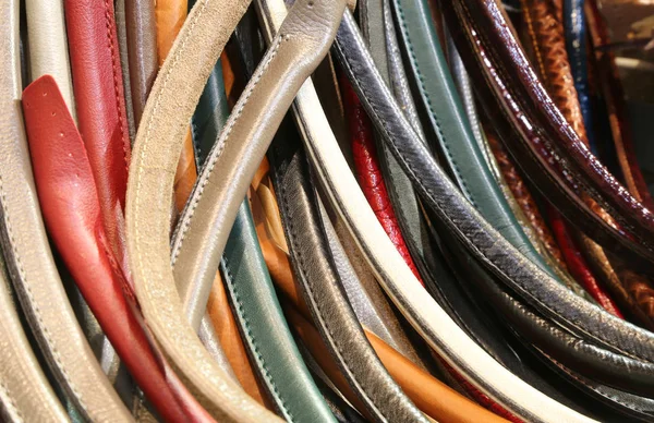 Many leather handles for the creation of leather handbags — Stock Photo, Image