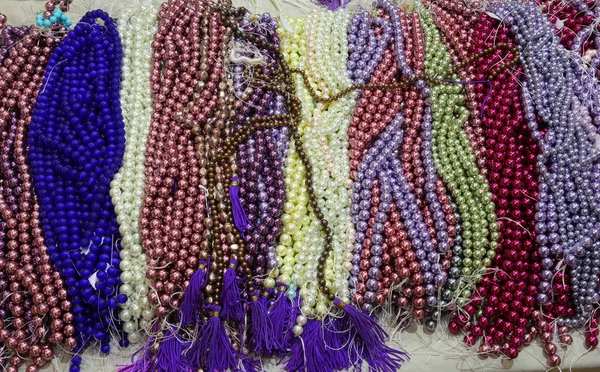 Background of necklaces made with thousands of colorful pearls — Stock Photo, Image