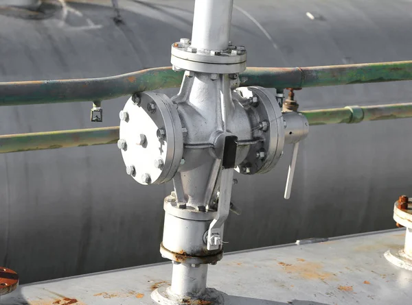 Safety valve above the large storage tank for gas — Stock Photo, Image