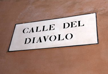 Venetian road sign with text Calle del Diavolo that means Street clipart