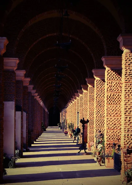 Long ancient porch of a cemetery — Stock Photo, Image