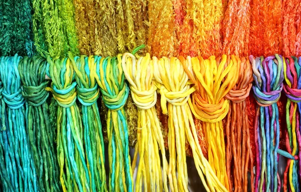 Colorful threads of knotted and woven fabric — Stock Photo, Image