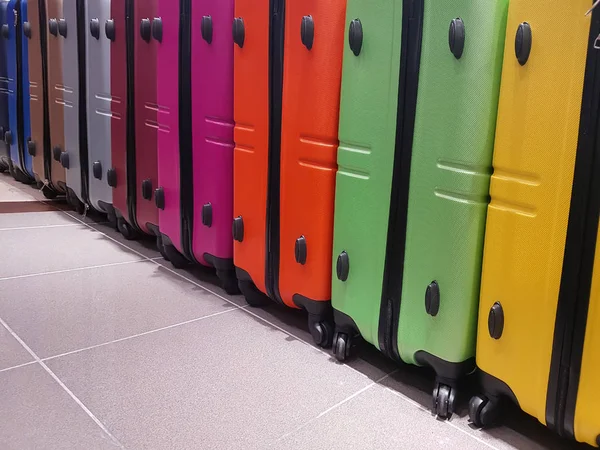 many colored suitcases of the travelers