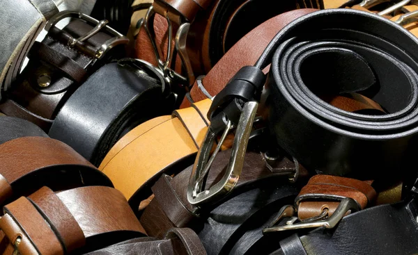 Many leather belts for sale — Stock Photo, Image