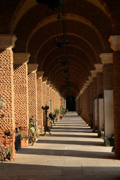 Long ancient porch of a cemetery — Stock Photo, Image