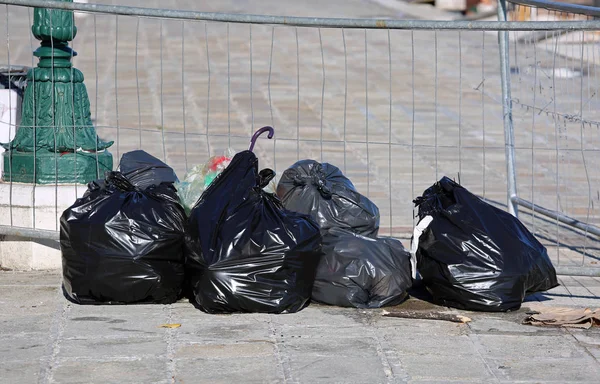 abandoned garbage bags in a city