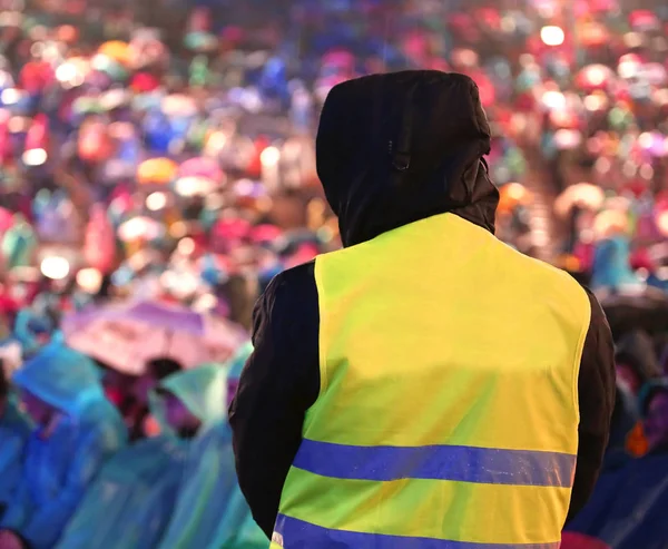 security guard controls people during an important event during