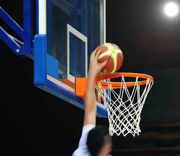 Ball down through the basket wtih power light — Stock Photo, Image