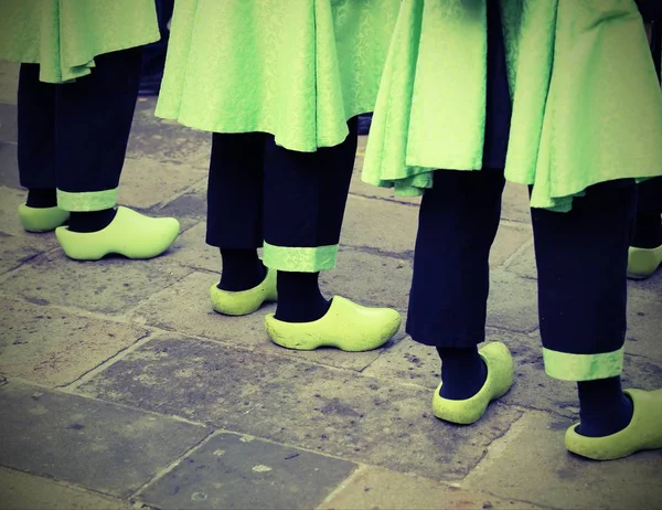 Dutch people with green clogs  with vintage effect