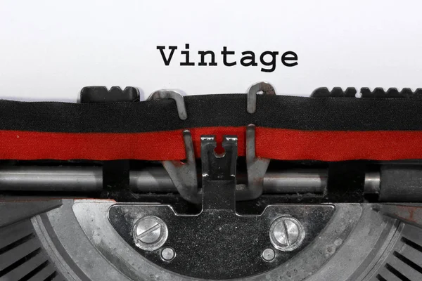 Text VINTAGE written with the typewriter — Stock Photo, Image