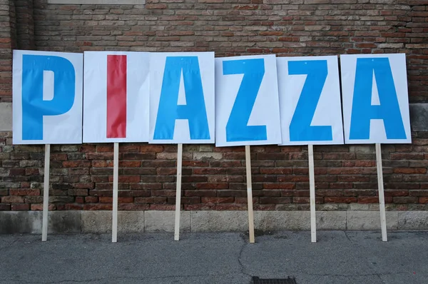 Big text PIAZZA which means Square in Italian language during a — Stock Photo, Image